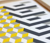 Close up of Geometric Cube in Yellow and Grey