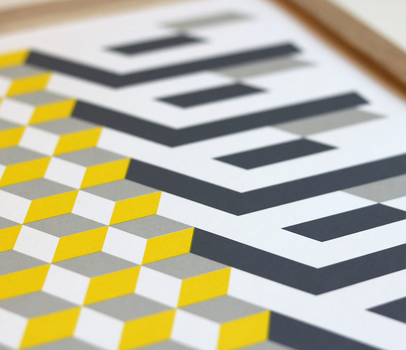 Close up of Geometric Cube in Yellow and Grey