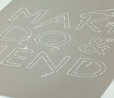Close of Make do and Mend Print in Warm Stone